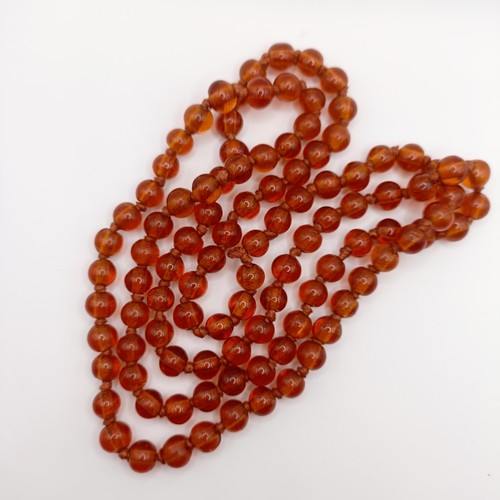 466 - An amber coloured glass bead necklace