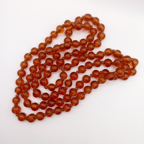 466 - An amber coloured glass bead necklace