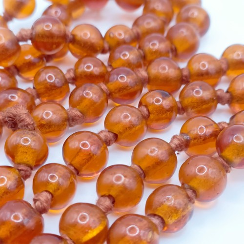 466 - An amber coloured glass bead necklace