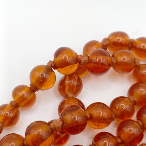 466 - An amber coloured glass bead necklace