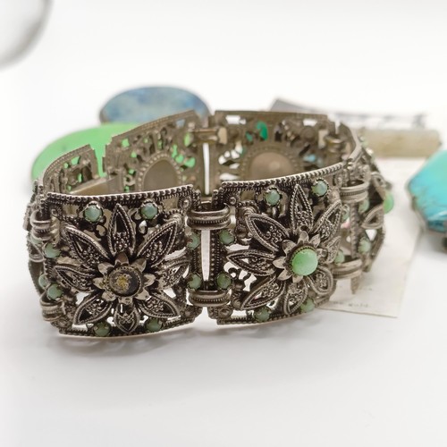 480 - An Indian white metal and turquoise bracelet, lacking some stones, four brooches and two rings (7)