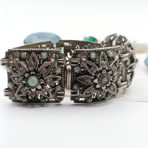 480 - An Indian white metal and turquoise bracelet, lacking some stones, four brooches and two rings (7)