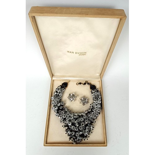 645 - A vintage paste set necklace, and a similar pair of earrings, boxed, retail mark for Nan Duskin