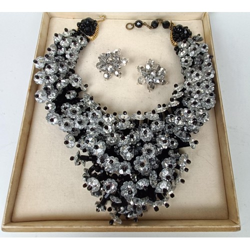 645 - A vintage paste set necklace, and a similar pair of earrings, boxed, retail mark for Nan Duskin