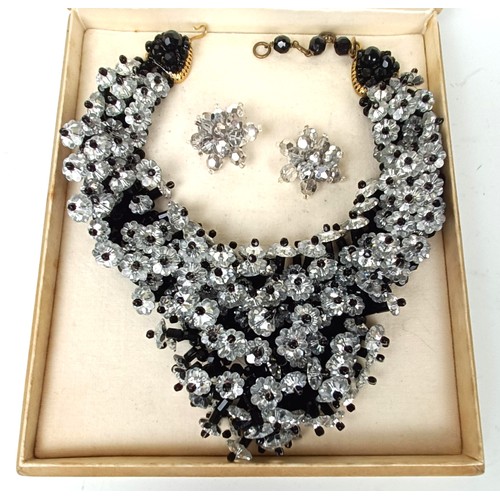 645 - A vintage paste set necklace, and a similar pair of earrings, boxed, retail mark for Nan Duskin