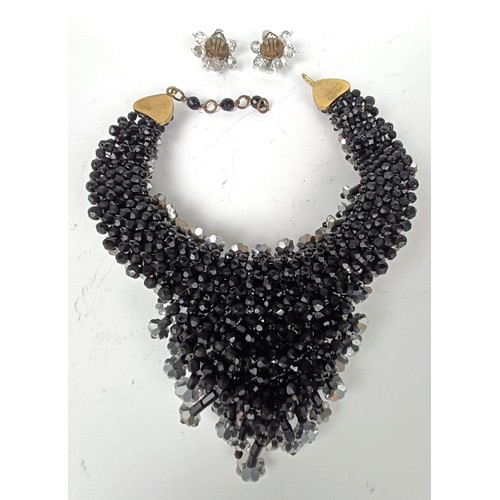 645 - A vintage paste set necklace, and a similar pair of earrings, boxed, retail mark for Nan Duskin