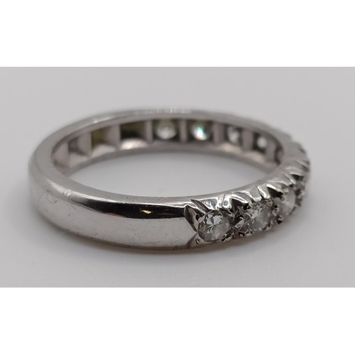 647 - A diamond half eternity ring, ring size M