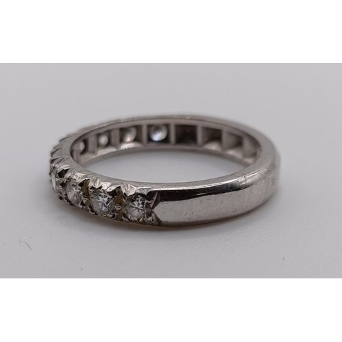 647 - A diamond half eternity ring, ring size M