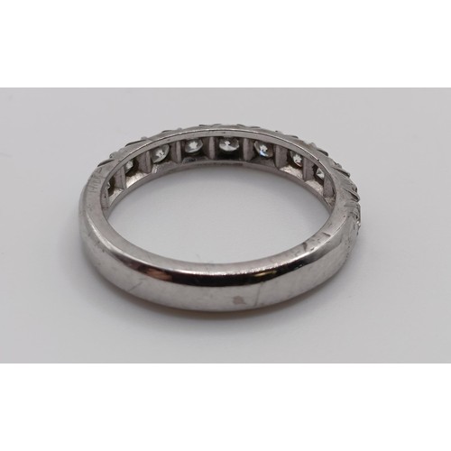 647 - A diamond half eternity ring, ring size M