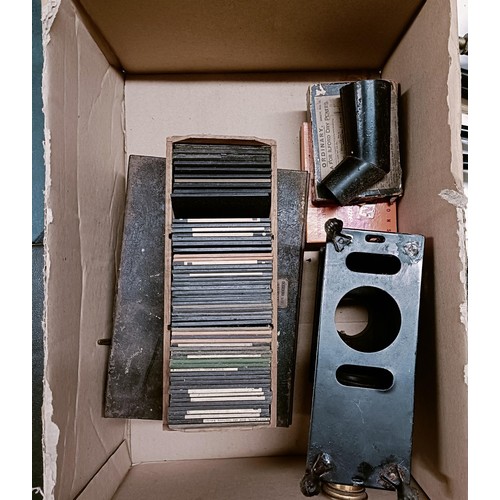 1122 - A vintage magic lantern, and assorted slides (box)...