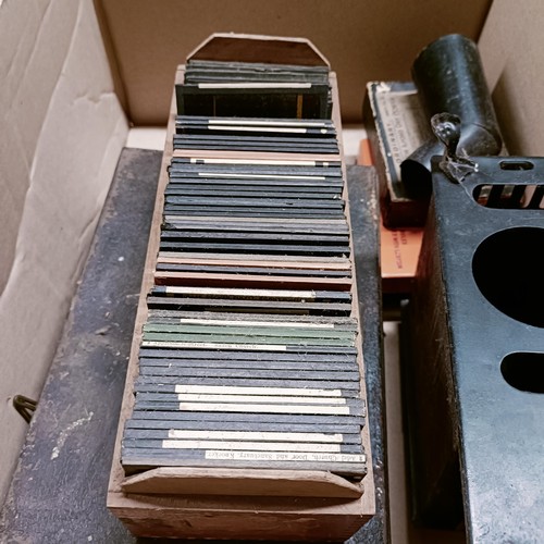 1122 - A vintage magic lantern, and assorted slides (box)