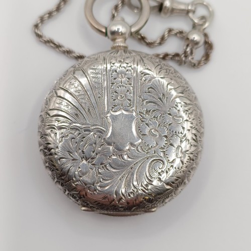 611 - A ladies  silver open face pocket watch, the movement signed J Dowell & Co, on a chain