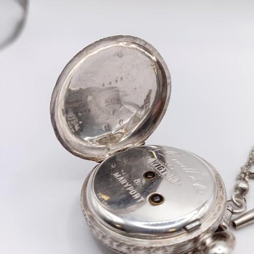 611 - A ladies  silver open face pocket watch, the movement signed J Dowell & Co, on a chain