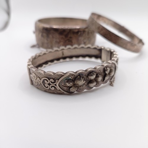 625 - A silver bangle, and two others, 73 g (3)