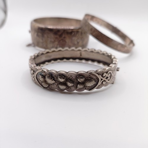 625 - A silver bangle, and two others, 73 g (3)