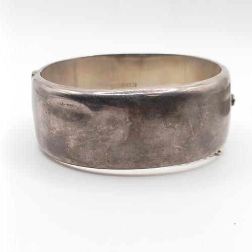 625 - A silver bangle, and two others, 73 g (3)