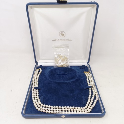 531 - A pearl triple strand necklace, with a 9ct gold clasp, by Coleman Douglas, cased