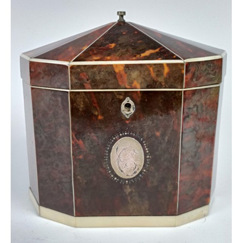 1175 - A George III decagon tea caddy, veneered in tortoiseshell and ivory banding, the front with a silver... 