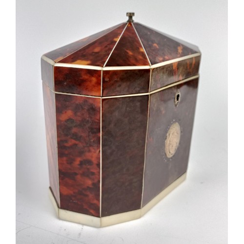 1175 - A George III decagon tea caddy, veneered in tortoiseshell and ivory banding, the front with a silver... 