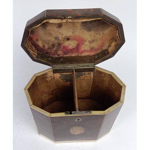 1175 - A George III decagon tea caddy, veneered in tortoiseshell and ivory banding, the front with a silver... 