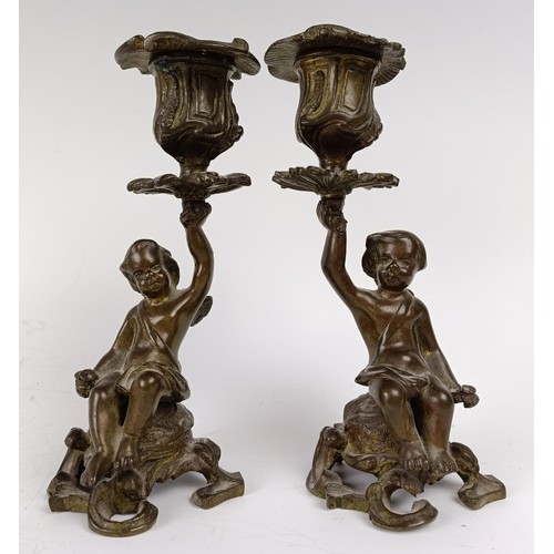 1178 - A pair of late 19th century bronze cherub candlesticks, 16. 5 cm high (2)