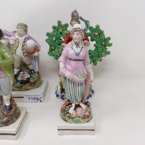 1169 - A pair of early 19th century Staffordshire hollow base bocage figures, of musicians, 18 cm high, a S... 