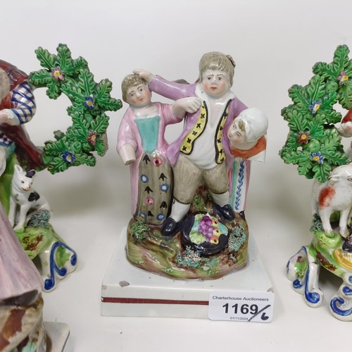 1169 - A pair of early 19th century Staffordshire hollow base bocage figures, of musicians, 18 cm high, a S... 