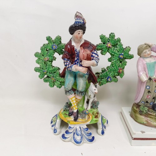 1169 - A pair of early 19th century Staffordshire hollow base bocage figures, of musicians, 18 cm high, a S... 