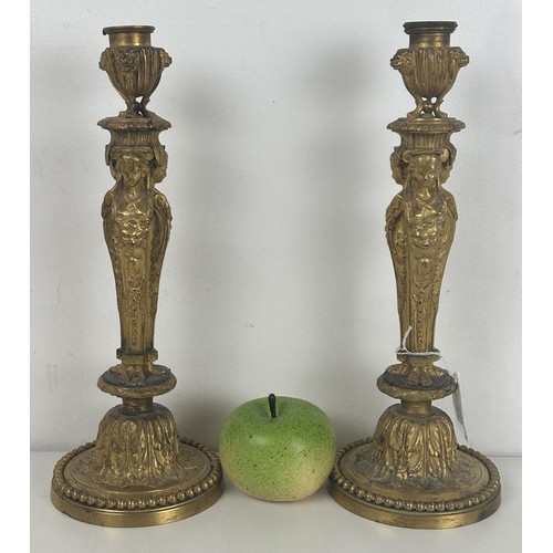 1237 - A pair of late 19th century ormolu candlesticks, with caryatid and acanthus leaf decoration, 31.5 cm... 