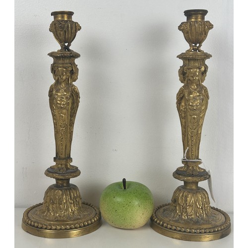 1237 - A pair of late 19th century ormolu candlesticks, with caryatid and acanthus leaf decoration, 31.5 cm... 