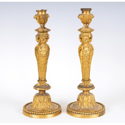 1237 - A pair of late 19th century ormolu candlesticks, with caryatid and acanthus leaf decoration, 31.5 cm... 