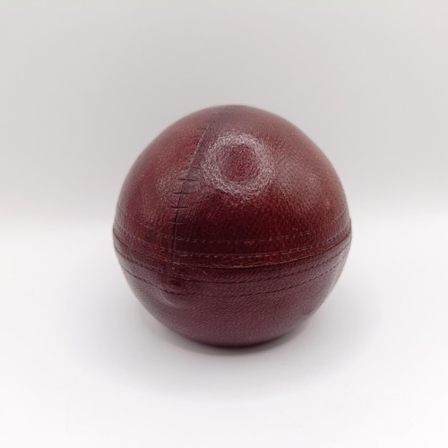 1009 - A Victorian novelty inkwell, in the form of a cricket ball, 7 cm diameter