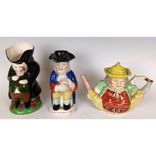 1154 - A toby jug, another, and brass ceiling light with glass shades and other items (box)