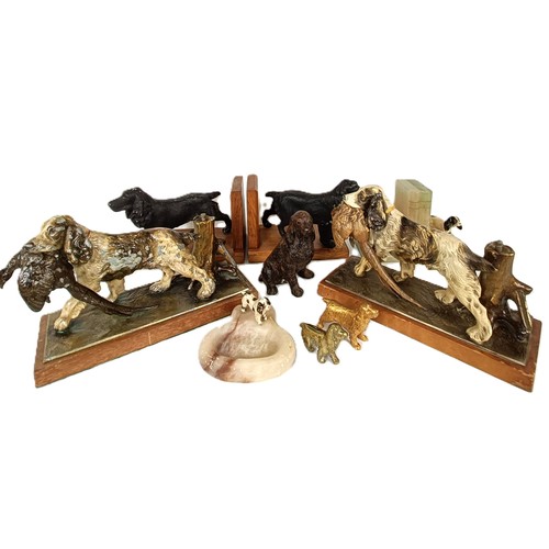 1157 - A novelty table lighter, in the form of a spaniel holding a pheasant, a pair of spaniel bookends, a ... 