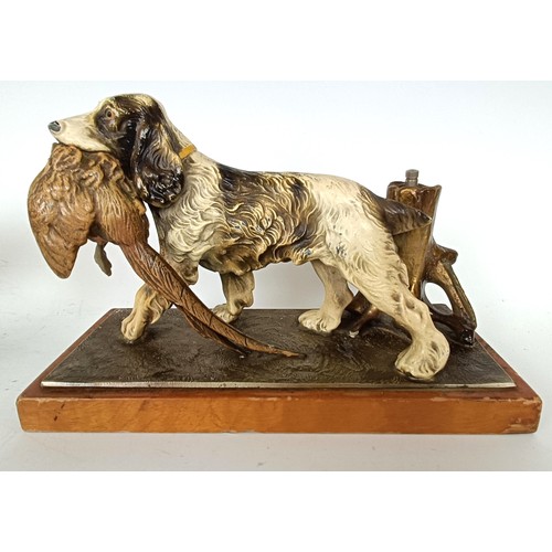 1157 - A novelty table lighter, in the form of a spaniel holding a pheasant, a pair of spaniel bookends, a ... 