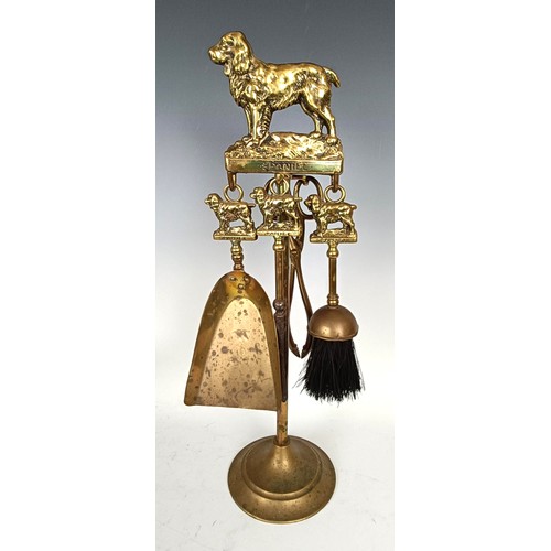 1157 - A novelty table lighter, in the form of a spaniel holding a pheasant, a pair of spaniel bookends, a ...