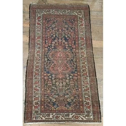 1287 - A Persian red ground rug, 200 x 112 cm