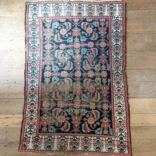 1289 - An Eastern red ground rug 150 x 100 cm