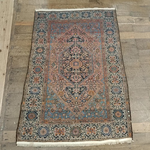 1291 - A Persian rug, 205 x 133 cm