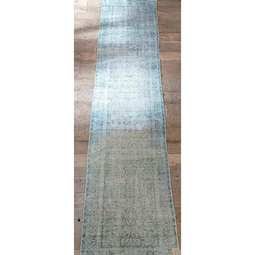 1307 - A Turkish green ground runner, 332 x 79 cm