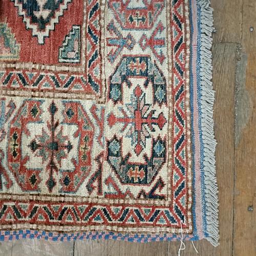 1312 - A Kazak red ground rug , 172 X 134 cm