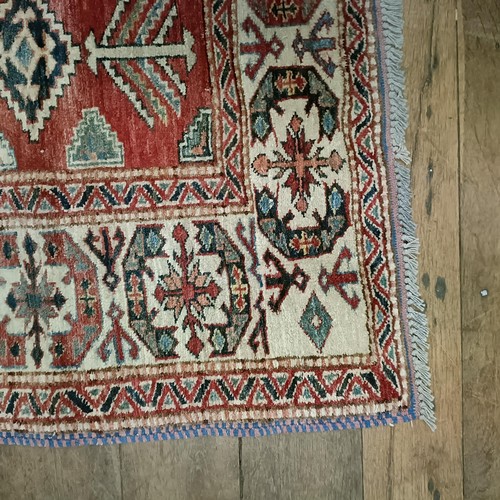 1312 - A Kazak red ground rug , 172 X 134 cm