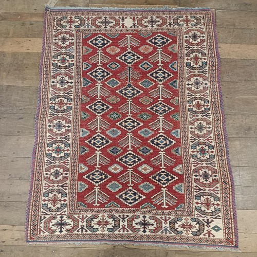 1312 - A Kazak red ground rug , 172 X 134 cm