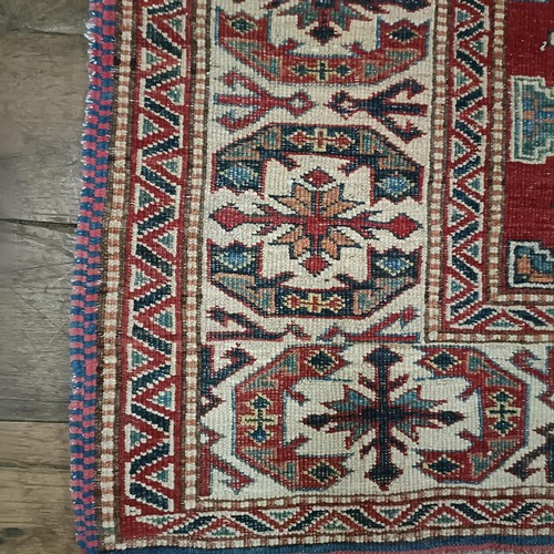 1312 - A Kazak red ground rug , 172 X 134 cm