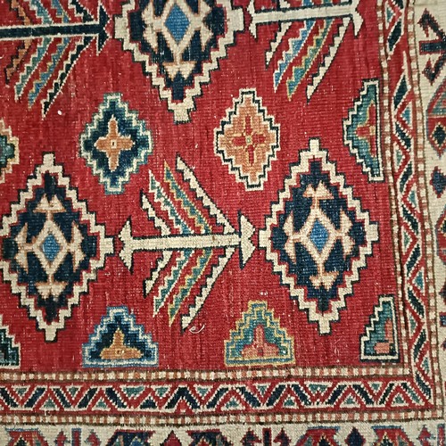 1312 - A Kazak red ground rug , 172 X 134 cm