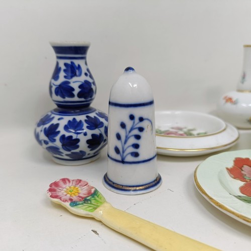 1261 - Assorted miniature ceramic items to include Meissen, Royal Worcester, a parasol handle and a candle ... 