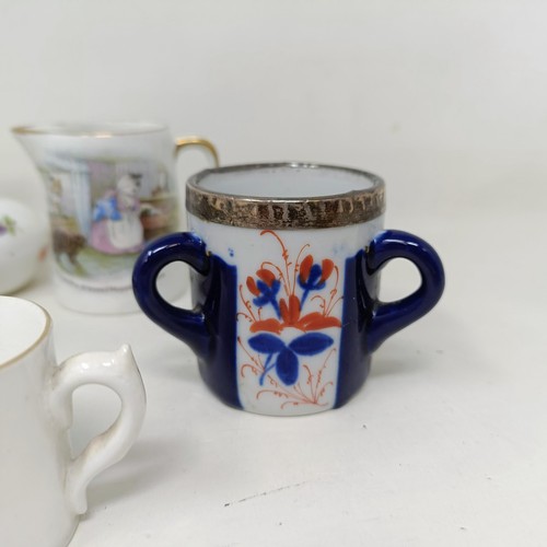 1261 - Assorted miniature ceramic items to include Meissen, Royal Worcester, a parasol handle and a candle ... 