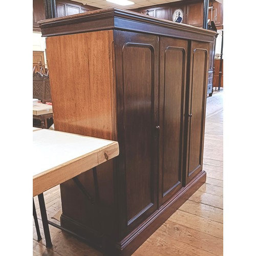 1359 - A mahogany compactum, having three cupboard doors, to reveal slides and drawers, 143 cm high x 140 c... 