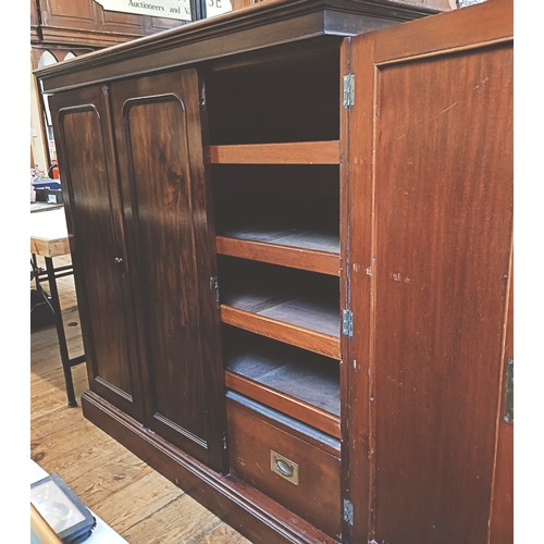 1359 - A mahogany compactum, having three cupboard doors, to reveal slides and drawers, 143 cm high x 140 c... 