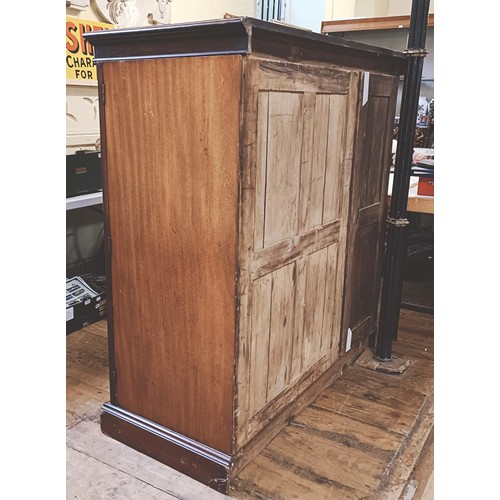 1359 - A mahogany compactum, having three cupboard doors, to reveal slides and drawers, 143 cm high x 140 c... 